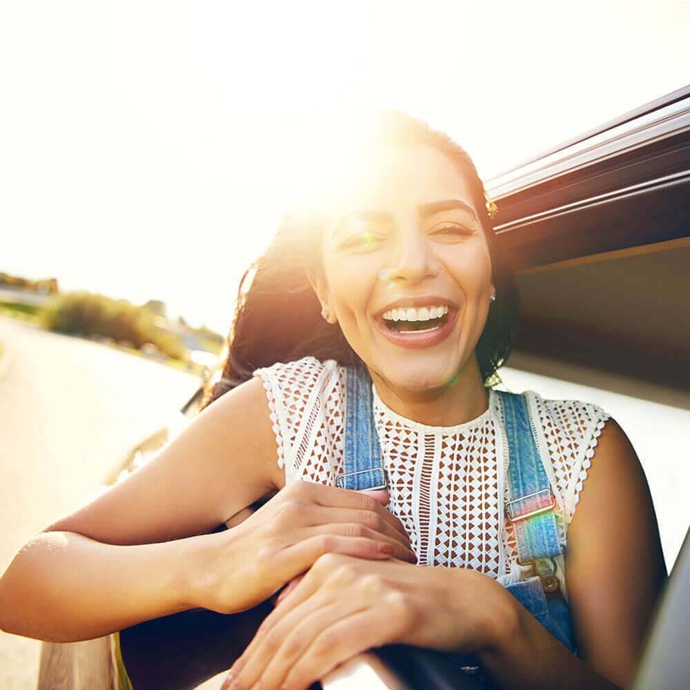 Smiling Young Woman In Car