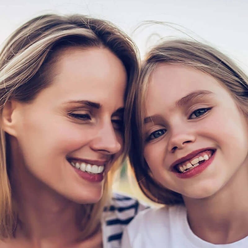 Smiling Mother With Daughter