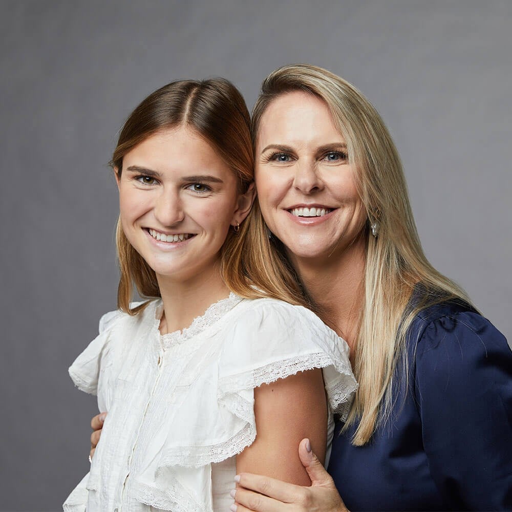 Mother And Daughter Smiling